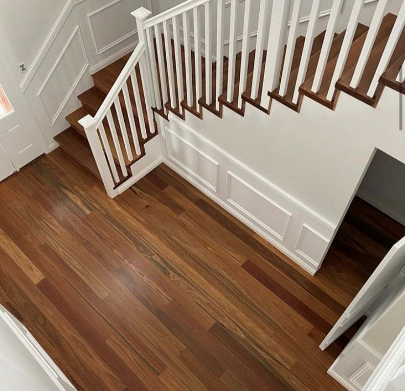 Photo of spotted gum flooring and stairwell | Featured Image for the Decking Timber Page of Versace Timbers.